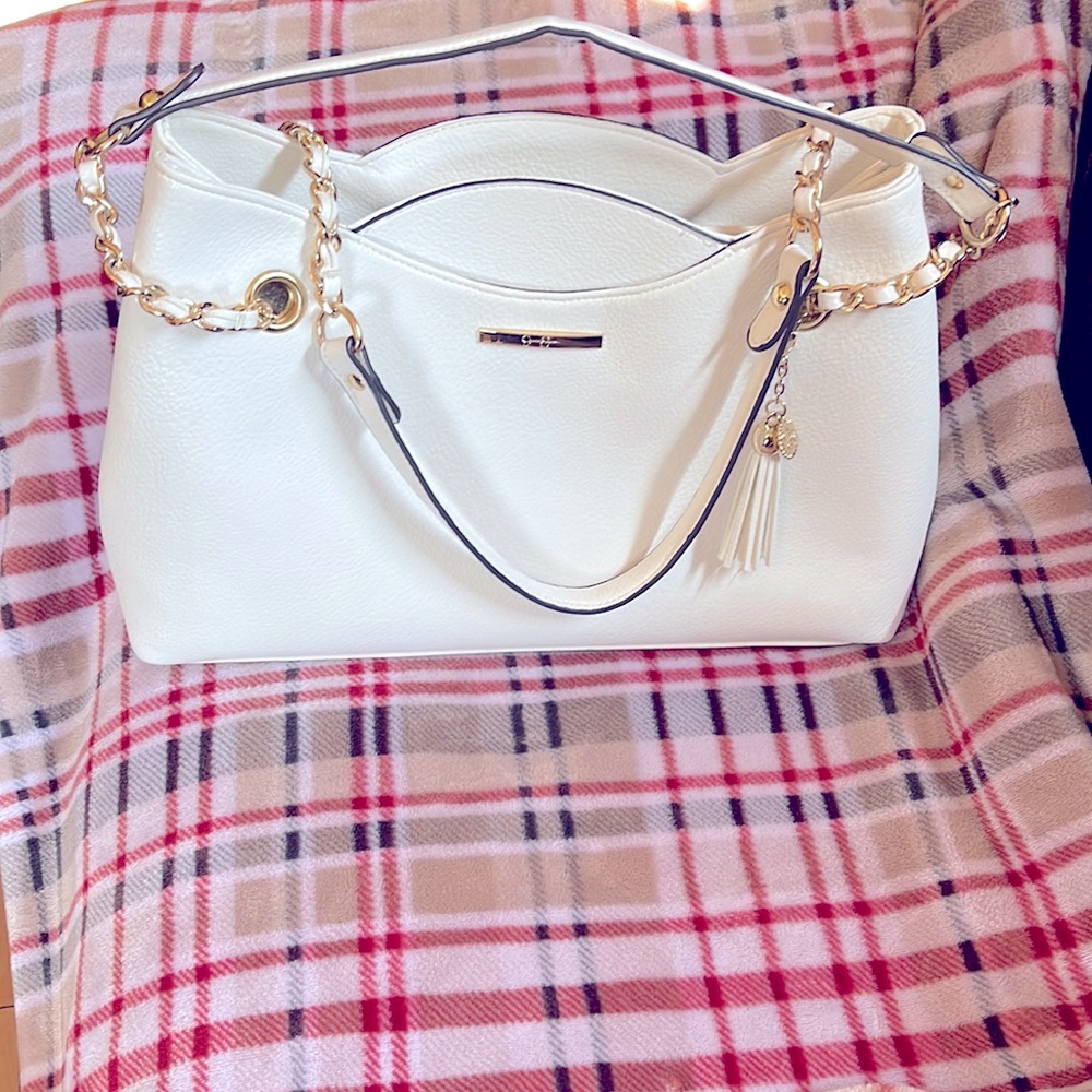 Jessica Simpson White bag with Gold finished hardware.